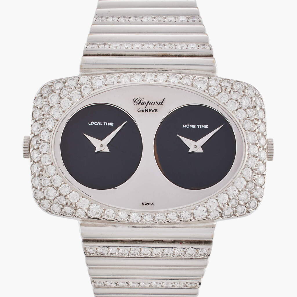 View full screen - View 1 of Lot 661. Reference 2051-1 | A white gold and diamond-set dual time zone bracelet watch with onyx dials, Circa 1970.