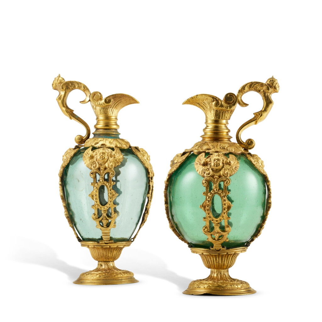 View full screen - View 1 of Lot 203. A near pair of gilt-bronze mounted glass ewers, Venice or Florence, late 16th-early 17th century.