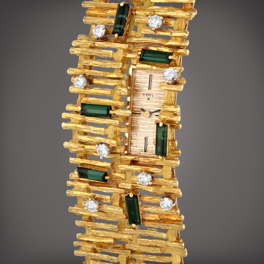 View full screen - View 1 of Lot 407. A yellow gold, diamond and tourmaline-set bracelet watch | Circa 1960s.