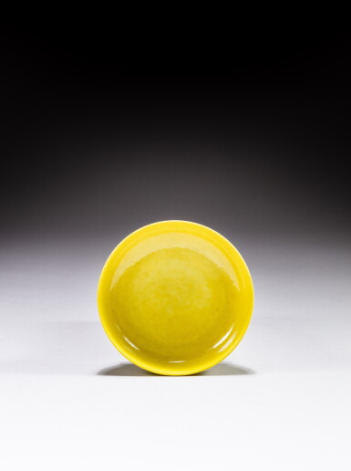 View full screen - View 1 of Lot 204. A small lemon yellow-glazed saucer dish, Mark and period of Yongzheng | 清雍正 檸檬黃釉小盤 《大清雍正年製》款.