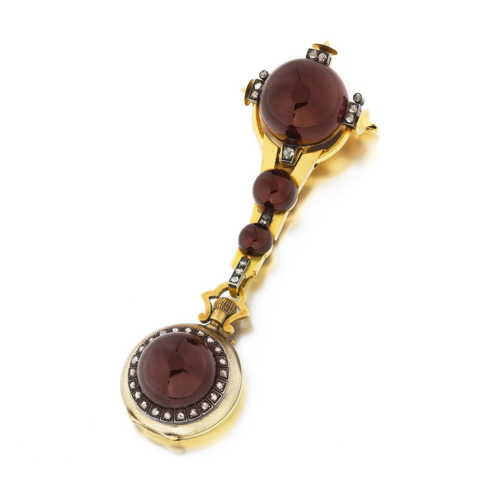 View full screen - View 1 of Lot 304. Broche-montre grenats et diamants | Garnet and diamond brooch-watch .