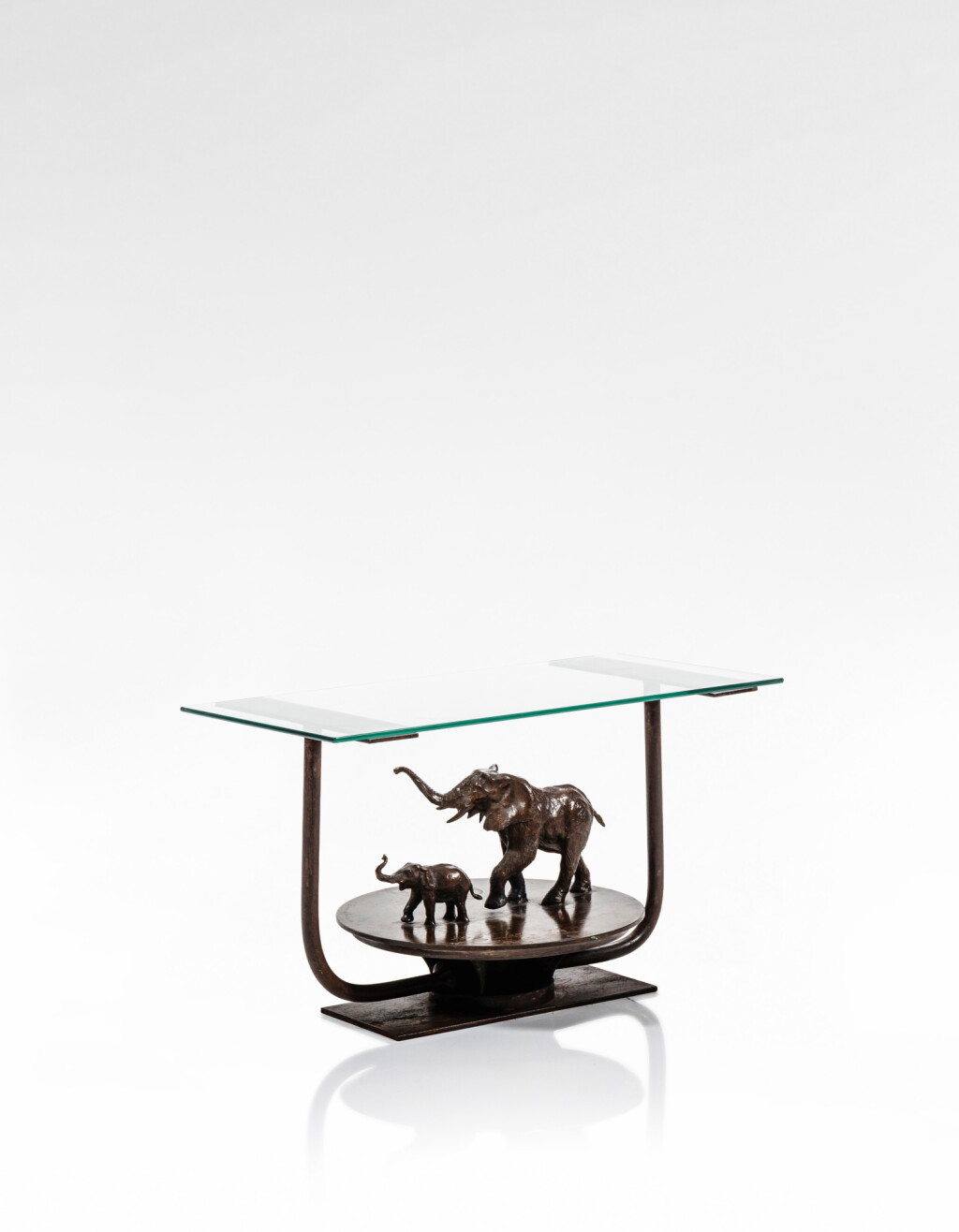 View full screen - View 1 of Lot 114. A patinated bronze and glass coffee table, 20th century.