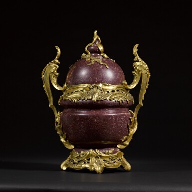View full screen - View 1 of Lot 54. An Egyptian red porphyry vase with cover, Italian, 17th century, with Louis XV style gilt-bronze mounts, mid-19th century.