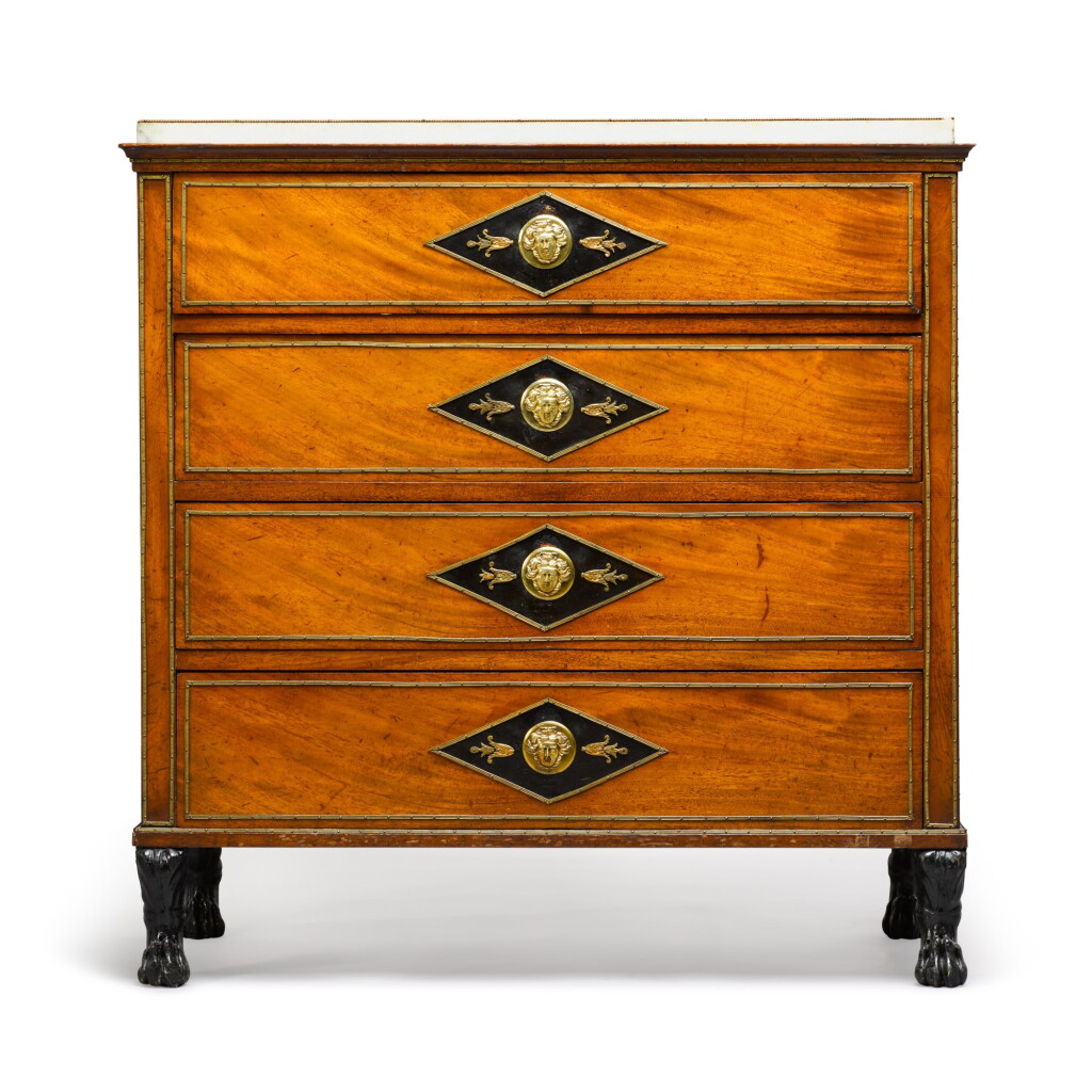 View full screen - View 1 of Lot 79. A German neoclassical gilt-brass mounted mahogany commode, circa 1800.