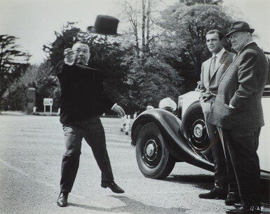 View full screen - View 1 of Lot 73. Sean Connery, Gert Fröbe and Harold Sakata, Production Still from 'Goldfinger', Stoke Park.