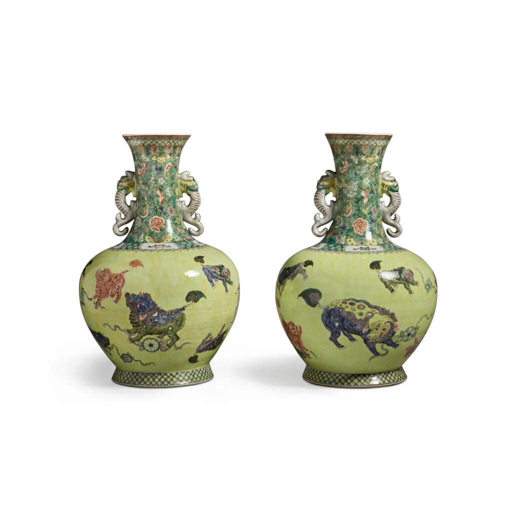 View full screen - View 1 of Lot 621. A pair of large yellow-ground famille-verte 'Buddhist lion' vases, 20th century | 二十世紀 黃地五彩獅子戲球紋雙耳大瓶一對.