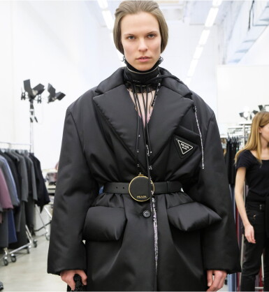 View full screen - View 1 of Lot 12. PRADA | RE-NYLON PUFFER COAT, ORGANZA SILK DRESS AND VANITY BELT, WORN BY KAT HESSEN.