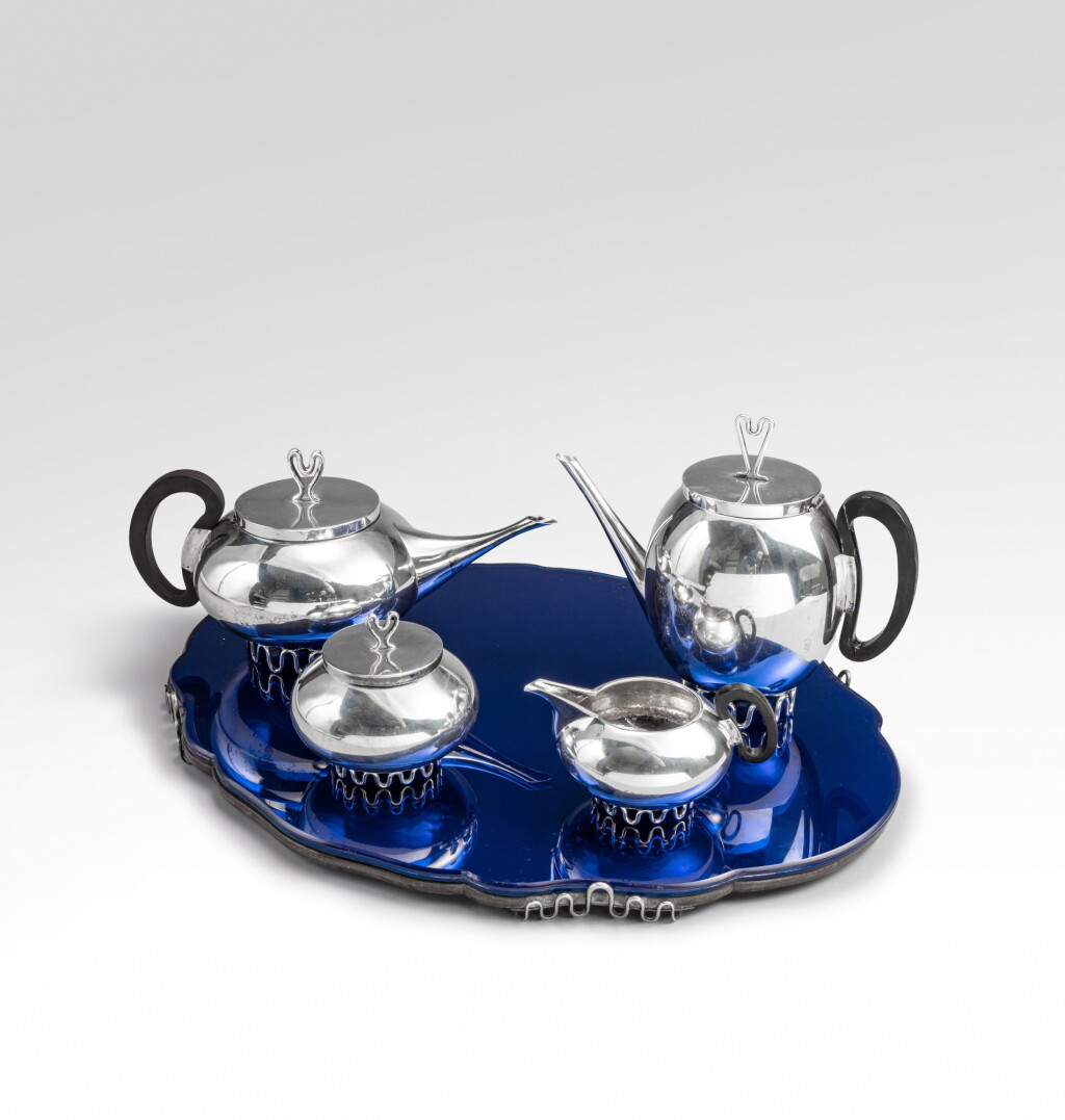View full screen - View 1 of Lot 60. Tea and coffee set including a teapot, a coffee pot, a milk jug, a sugar bowl and a tray, the model created around 1939.