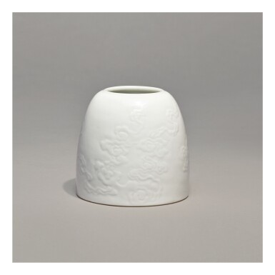 View full screen - View 1 of Lot 110. A WHITE-GLAZED CARVED 'BEEHIVE' WATERPOT, KANGXI MARK AND PERIOD.