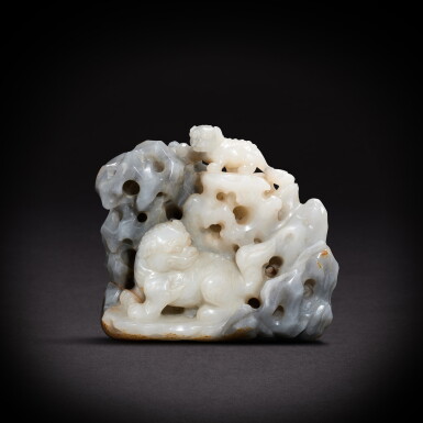 View full screen - View 1 of Lot 9481. A grey and white jade 'lion' boulder, Qing dynasty, 18th century | 清十八世紀 灰白玉福獅山子.