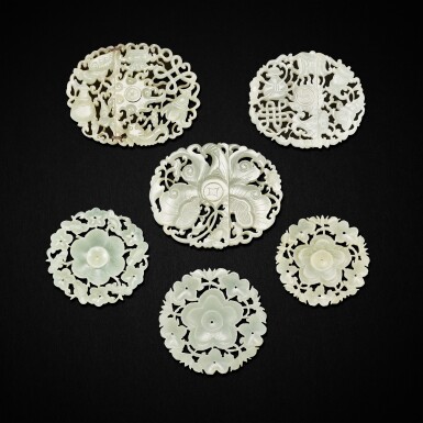 View full screen - View 1 of Lot 3048. Three reticulated pale celadon jade 'floral' buttons and three plaques, Ming dynasty 明 青白玉鏤空雕花卉紋紐扣三件及飾件三件.