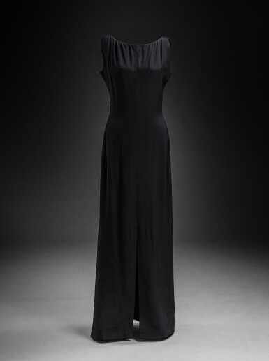 View full screen - View 1 of Lot 267. Long Haute Couture dress in black silk crepe, low-cut back, circa 1960.