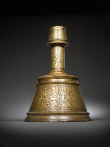 View full screen - View 1 of Lot 134. A large Mamluk brass candlestick, made for Sayf al-Din Hatim Dawadar, Egypt, circa 1500.