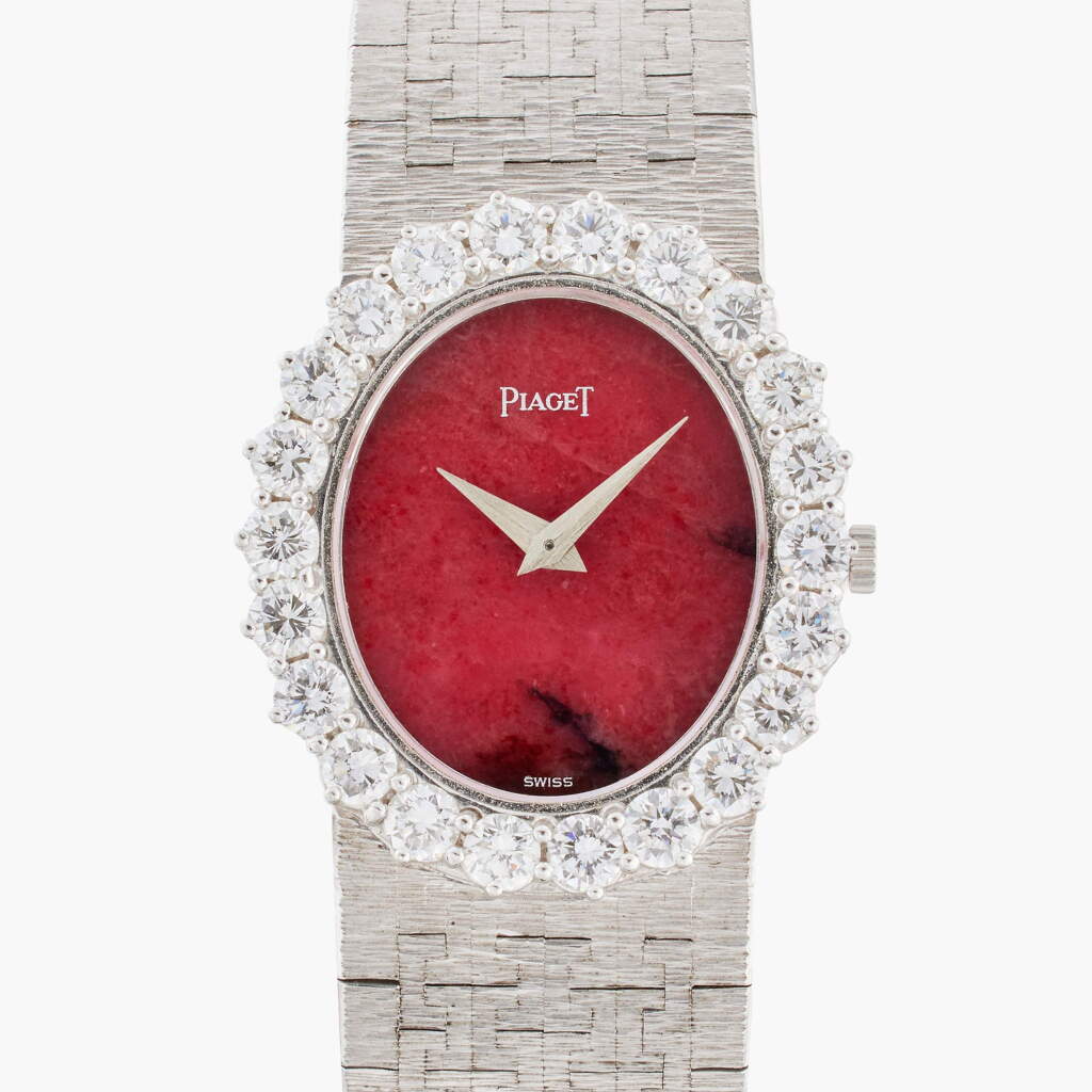 View full screen - View 1 of Lot 526. Reference 9338 A6 | A white gold and diamond-set bracelet watch with red jasper dial, Circa 1975.