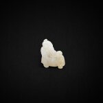 A white jade carving of a seated man and boy holding a basket, Qing dynasty, 18th century | 清十八世紀 白玉雕父子豐收圖把件