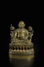 An inscribed silver and copper inlaid copper alloy figure of Lowo Khenchen Sonam Lhundrup, Tibet, 16th century