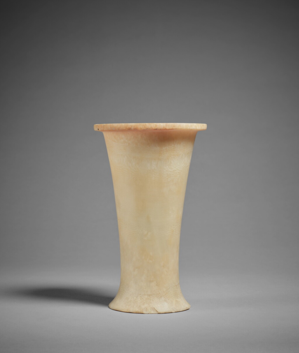 View full screen - View 1 of Lot 303. An Egyptian Alabaster Beaker, Old Kingdom, 5th-6th Dynasty, circa 2520-2195 B.C..