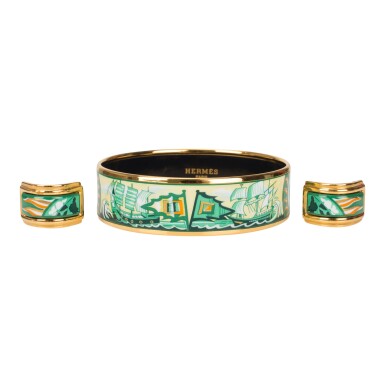 View full screen - View 1 of Lot 98. Hermès Vintage "Sailing Ships" Enamel Jewelry Set of Wide Printed Enamel Bracelet PM (65) and Clip On Enamel Earrings With Gold Plated Hardware.