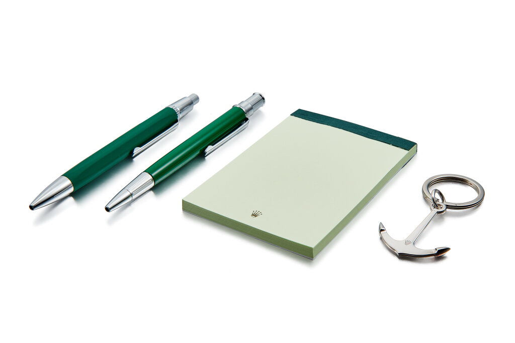 View full screen - View 1 of Lot 8191. A set of two ballpoint pens, memo pad and a Submariner anchor keychain, Made for Basel World 2020 | 勞力士 | 一套兩支圓珠筆、備忘錄及 Submariner 船錨鑰匙扣,為 Basel World 2020 而製.