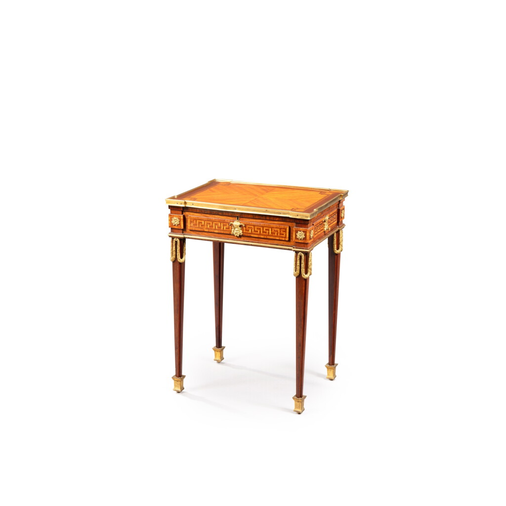 View full screen - View 1 of Lot 148. A Louis XVI gilt-bronze mounted tulipwood, amaranth and rosewood marquetry table d'appoint, circa 1780, in the taste of Montigny | Table d'appoint en marqueterie de bois de rose, amarante, palissandre et bronze doré d'époque Louis XVI, vers 1780, dans le goût de Montigny.