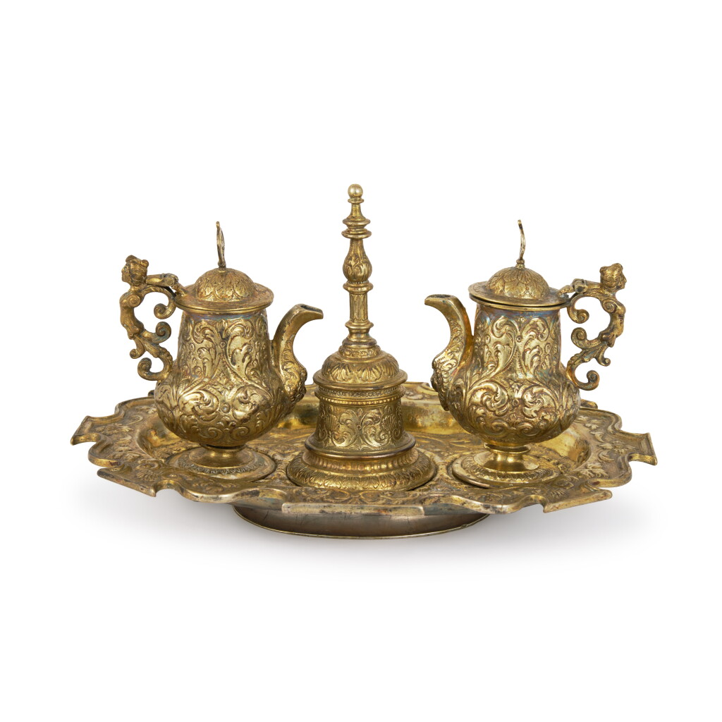 View full screen - View 1 of Lot 9. A Mexican Silver-Gilt Altar Cruet Set, With Assay Master’s Mark Of Diego Gonzales De La Cueva, Mexico City, Circa 1730-40.