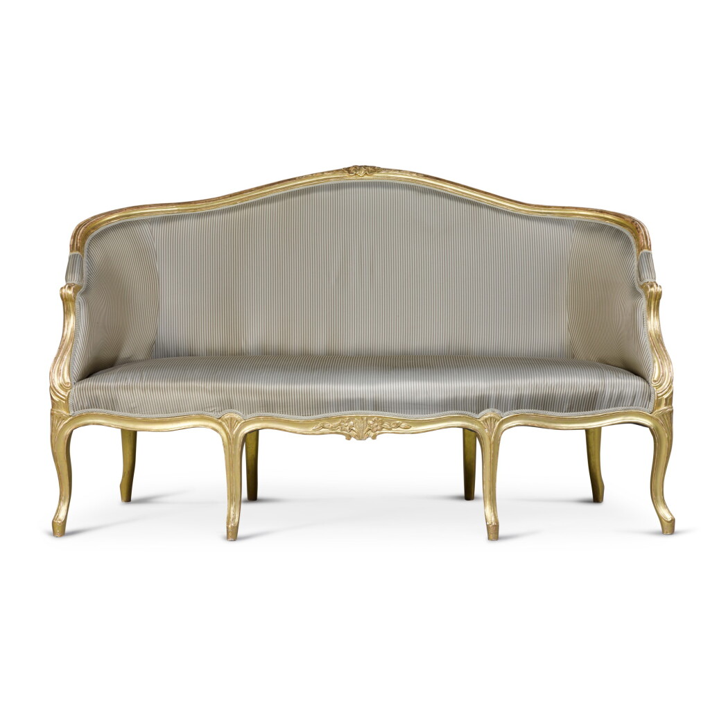 View full screen - View 1 of Lot 19. A George III giltwood and upholstered settee, circa 1775.