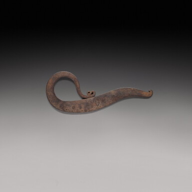 View full screen - View 1 of Lot 206. A bronze flat hook and an engraved steel vice, India, 19th century.
