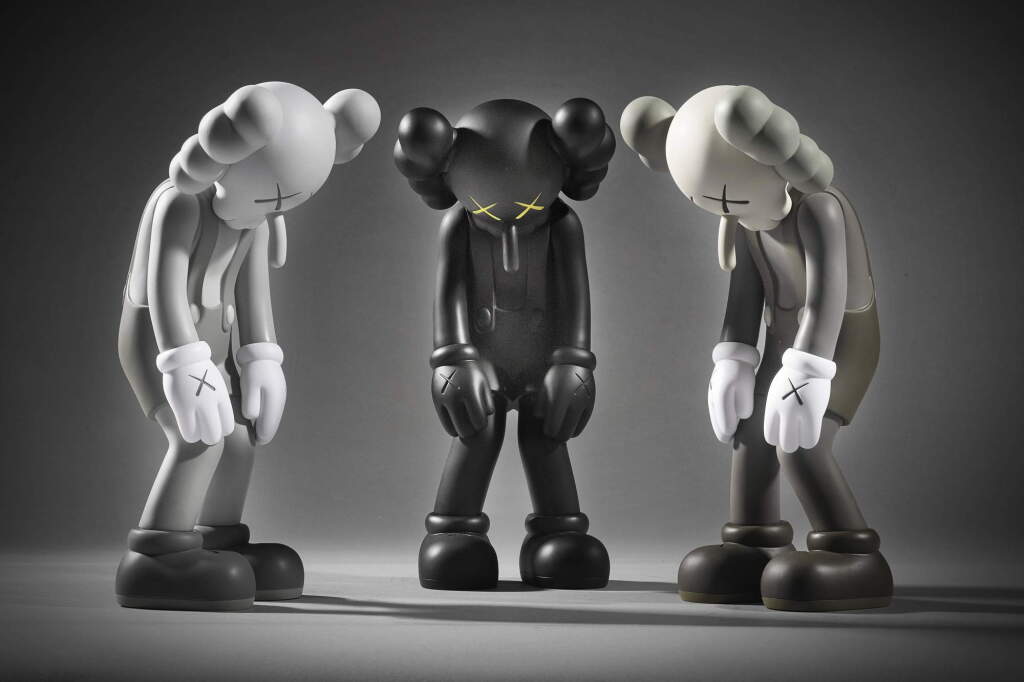 View full screen - View 1 of Lot 504. KAWS | THREE WORKS: (I) SMALL LIE (BROWN); (II) SMALL LIE (BLACK); (III) SMALL LIE (GREY).