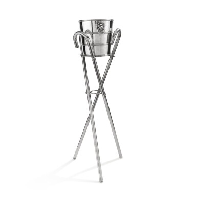 View full screen - View 1 of Lot 361. An Italian silver bottle-bucket, Buccellati, Milan, circa 1980 and a stand made of 3 silver metal canes | Seau à bouteille en argent par Buccellati, Milan, vers 1980 et un support formé de 3 cannes en métal-argenté.