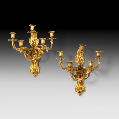 View full screen - View 1 of Lot 131. A pair of gilt-bronze five-light wall-lights, Louis XV style, late 19th century | Paire d'appliques à cinq lumières en bronze doré de style Louis XV, fin XIXe siècle.