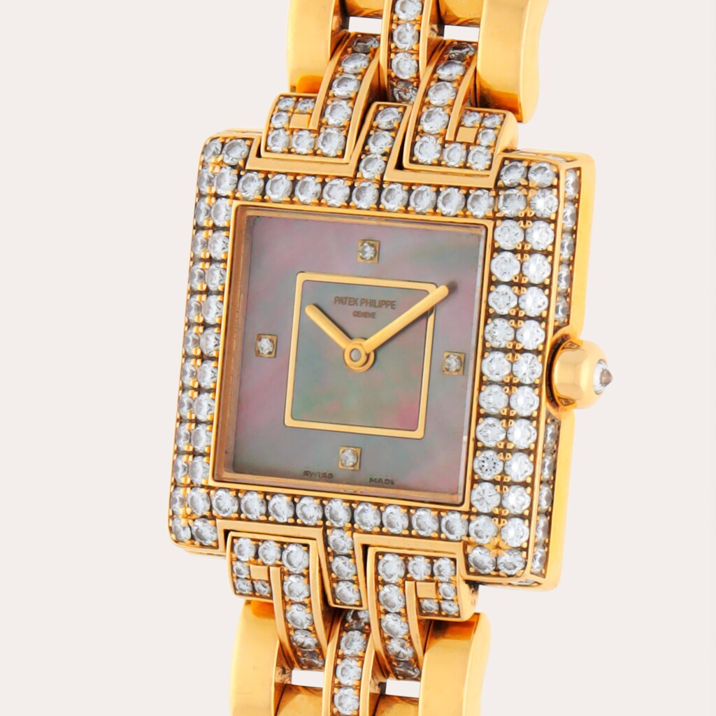 View full screen - View 1 of Lot 297. Reference 4874/2 | A yellow gold and diamond-set bracelet watch with mother-of-pearl dial | Circa 2006.