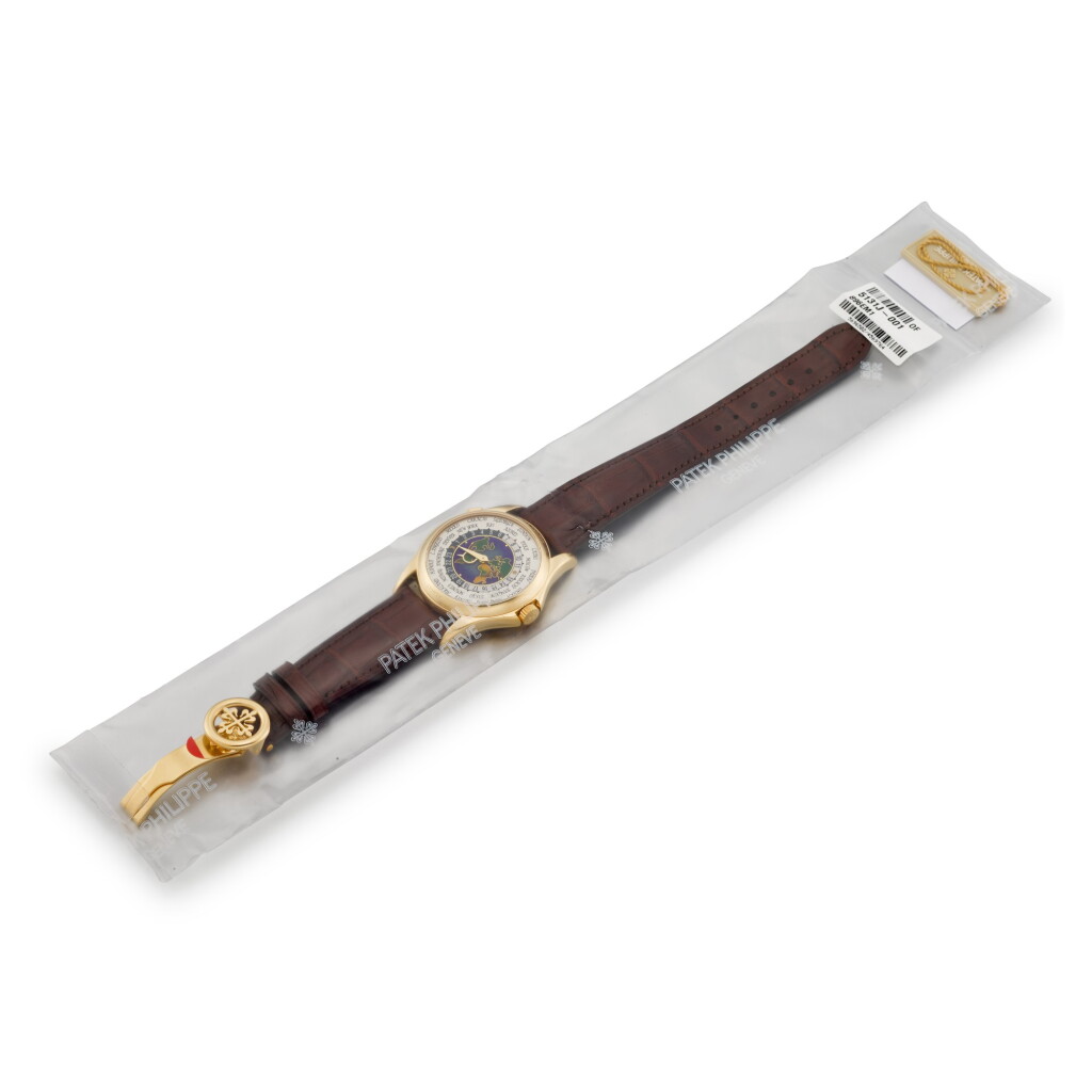 View full screen - View 1 of Lot 2198. Reference 5131 | A brand new yellow gold world time wristwatch with cloisonné enamel dial, Circa 2013 | 百達翡麗 | 型號5131 | 全新黃金世界時間腕錶,備掐絲琺瑯錶盤,約2013年製 .