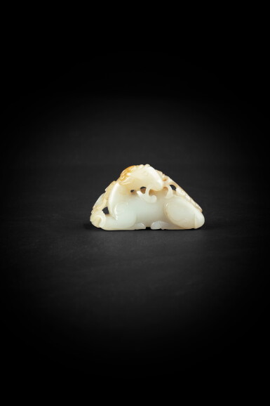 View full screen - View 1 of Lot 112. A pale celadon and russet jade 'deer and lingzhi' carving Qing dynasty, 18th-19th century | 清十八至十九世紀 青白玉鹿銜靈芝把件.