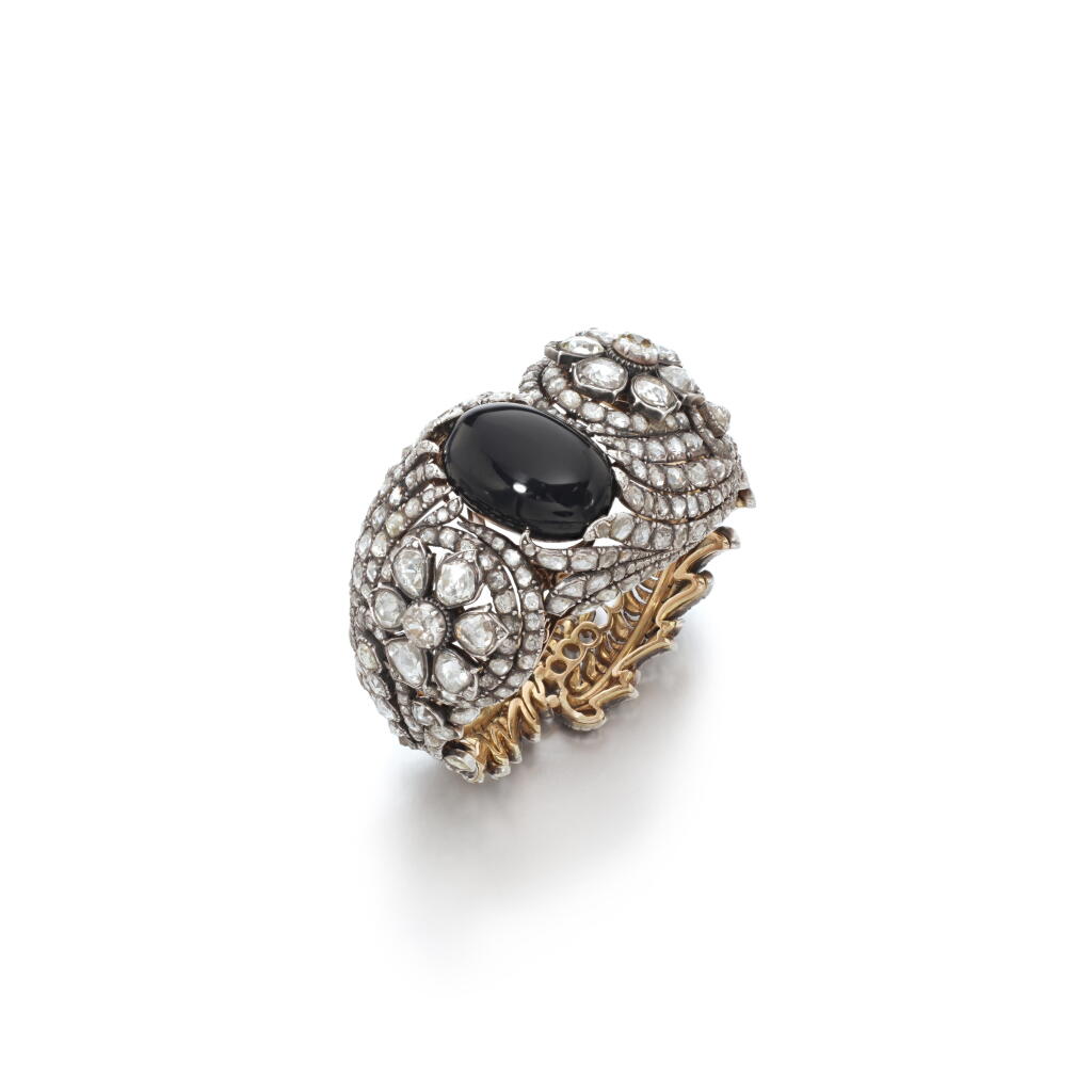 View full screen - View 1 of Lot 1030. Onyx and diamond bangle, late 19th century.