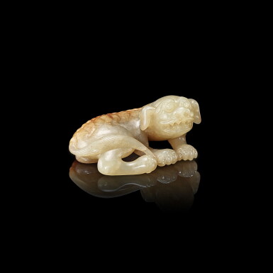 View full screen - View 1 of Lot 3019. A celadon and russet jade mythical beast, Ming dynasty or earlier 明或更早 青玉瑞獸.
