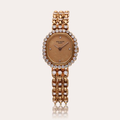 View full screen - View 1 of Lot 456. Reference 4597/001 | A yellow gold and diamond-set bracelet watch, Circa 1985.