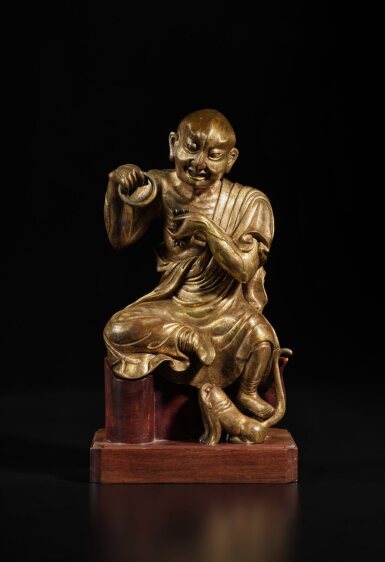 View full screen - View 1 of Lot 134. A gilt-bronze figure of Nakula, Ming dynasty | 明 銅鎏金靜坐羅漢像.