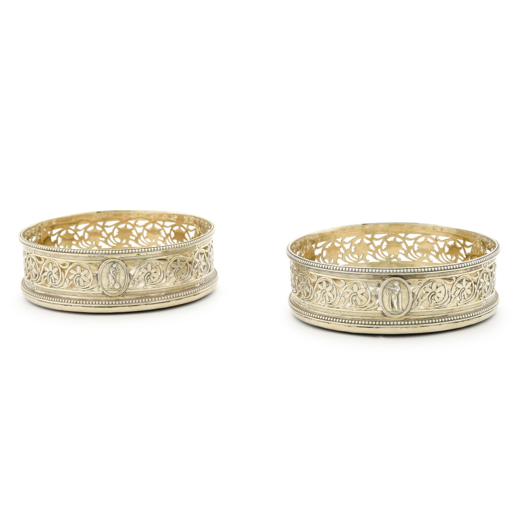 View full screen - View 1 of Lot 62. A pair of George III silver-gilt coasters, Robert Hennell, London 1783.