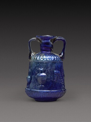 View full screen - View 1 of Lot 3. A Roman Cobalt Blue Mould-Blown Glass Amphoriskos, circa 1st century A.D..