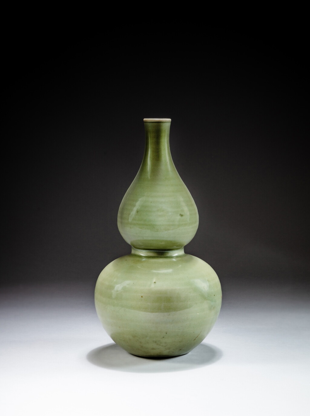 View full screen - View 1 of Lot 41. A rare 'Longquan' celadon-glazed double-gourd vase, Ming dynasty | 明 龍泉青釉葫蘆瓶.