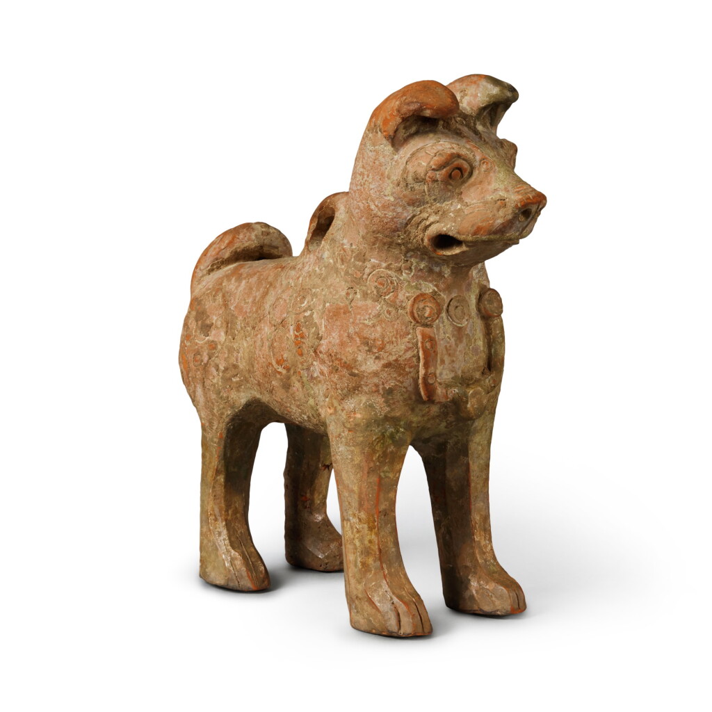 View full screen - View 1 of Lot 666. A green-glazed pottery figure of a dog, Han dynasty | 漢 綠釉加彩陶犬.