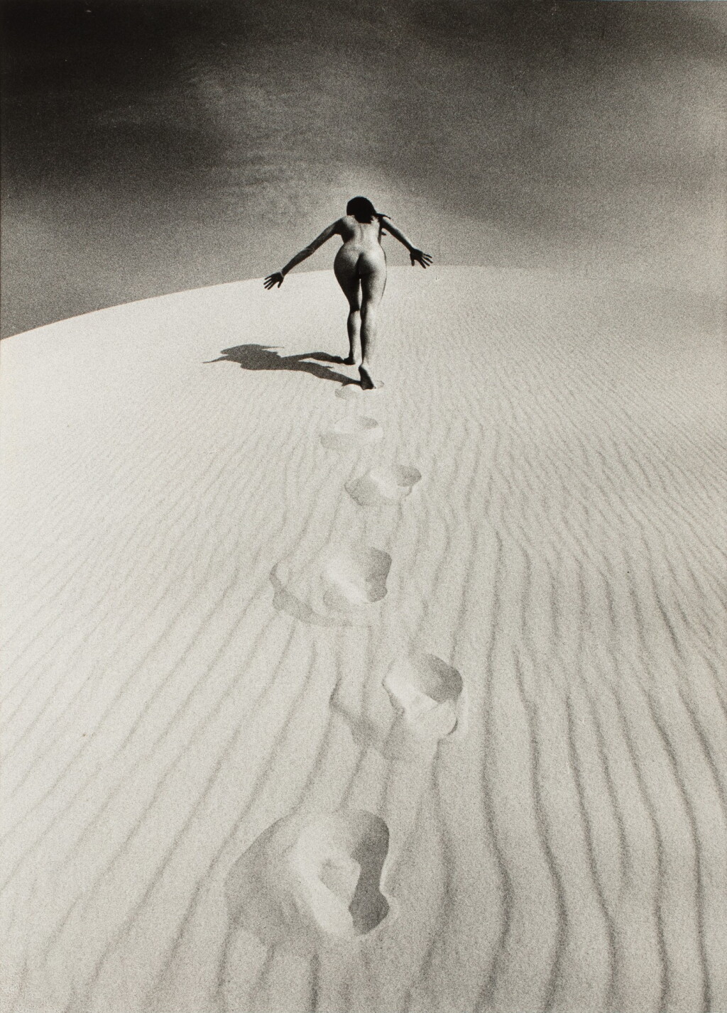 View full screen - View 1 of Lot 5. JEANLOUP SIEFF | FEMME NUE GRAVISSANT UNE DUNE, 1970.