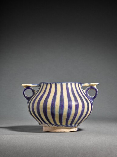 View full screen - View 1 of Lot 104. A double-handled Kashan pottery goblet, Persia, late 12th/early 13th century.