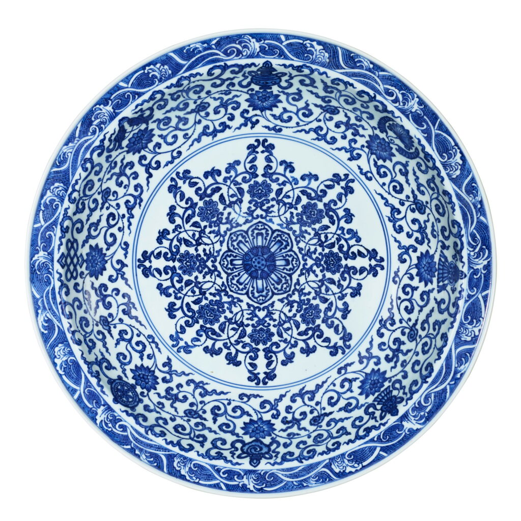 View full screen - View 1 of Lot 3805. A blue and white 'bajixiang' charger Mark and period of Yongzheng | 清雍正 青花寶相花蓮托八吉祥紋折沿大盤 《大清雍正年製》款.