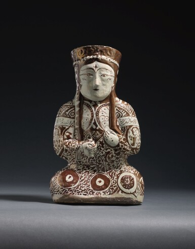 View full screen - View 1 of Lot 212. A KASHAN LUSTRE POTTERY VESSEL IN THE FORM OF A SEATED FEMALE RULER, PERSIA, 12TH/13TH CENTURY .