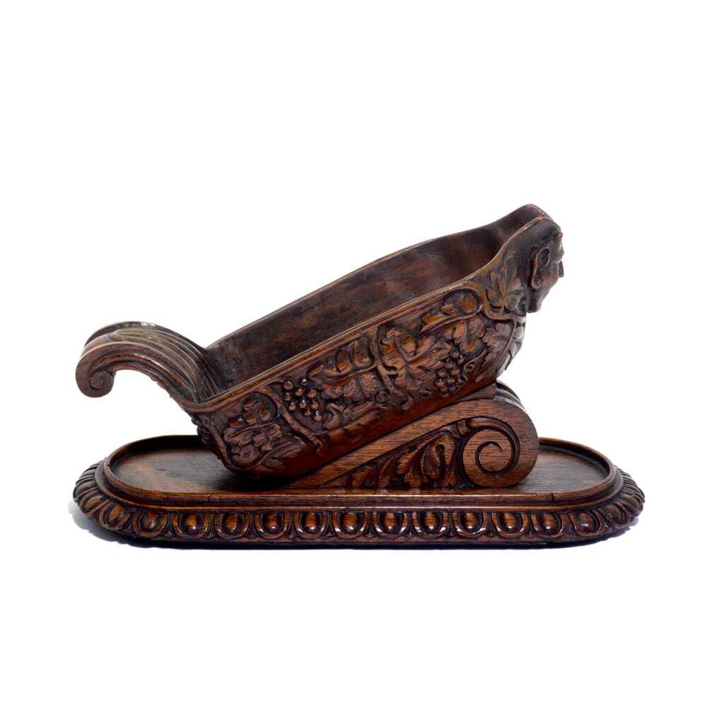 View full screen - View 1 of Lot 114. A carved oak wine pourer, 19th century.