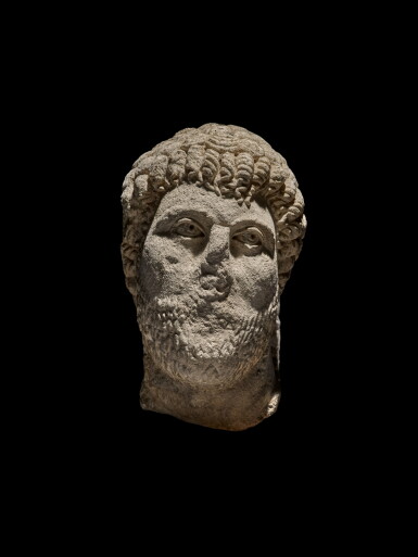 View full screen - View 1 of Lot 45. A Roman Limestone Head of a Man, circa 4th/5th Century A.D.