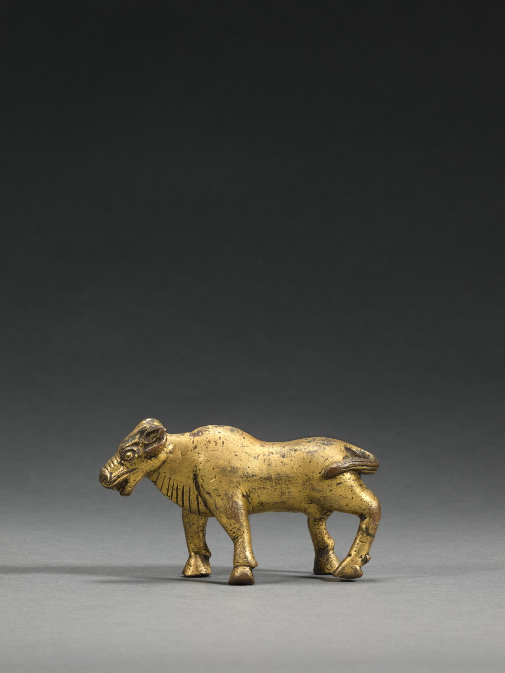 View full screen - View 1 of Lot 70. A gilt-copper alloy figure of a yak, Nepal or Tibet, 15th/16th century | 十五/十六世紀 尼泊爾或西藏 鎏金銅合金牛.