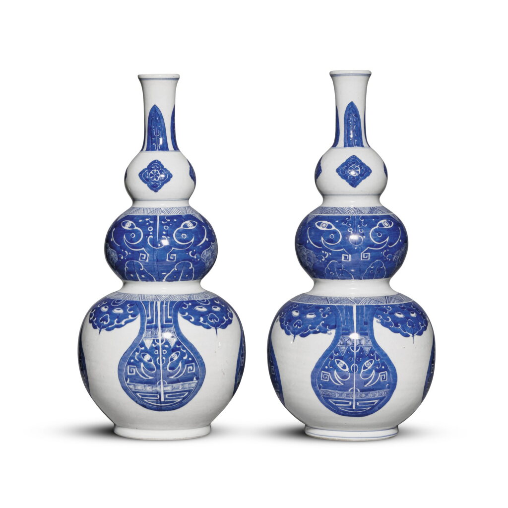 View full screen - View 1 of Lot 635. A pair of blue and white triple-gourd 'taotie' vases, Qing dynasty, 19th century | 清十九世紀 青花仿古饕餮紋三節葫蘆瓶一對.