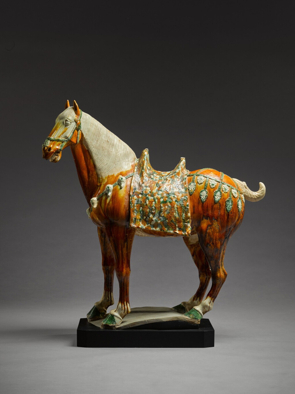 View full screen - View 1 of Lot 6. A magnificent large sancai-glazed figure of a caparisoned horse, Tang dynasty | 唐 三彩馬.